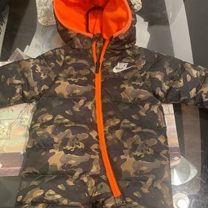 This is a 0-3month Nike snowsuit orange and camouflage